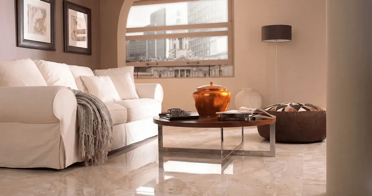 Modern living room with professionally installed marble flooring, a beige sofa, coffee table in El Paso, TX