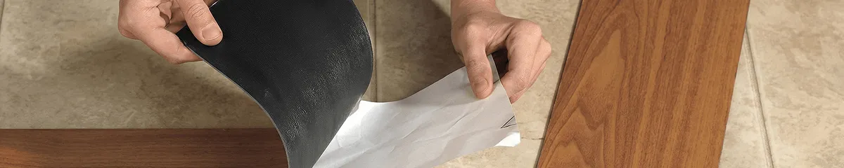 A professional installing vinyl flooring in El Paso, TX